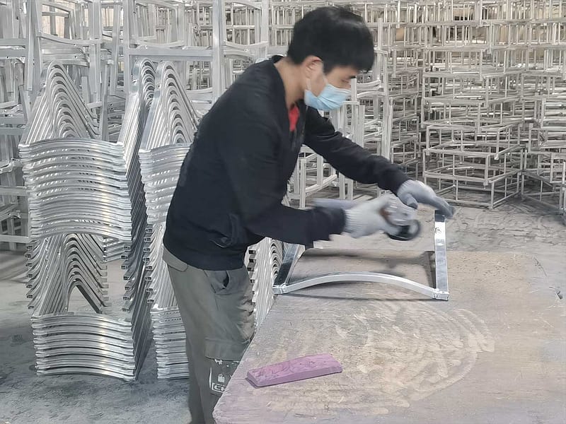 Home 17 Outdoor Furniture Supplier-China Factoery-Manufacturer a worker is polishing aluminum frame